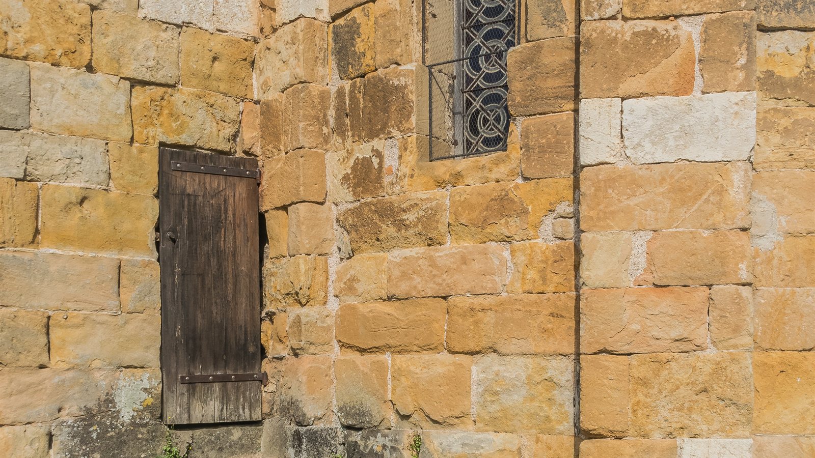 Coursed rubble stone wall of an old church