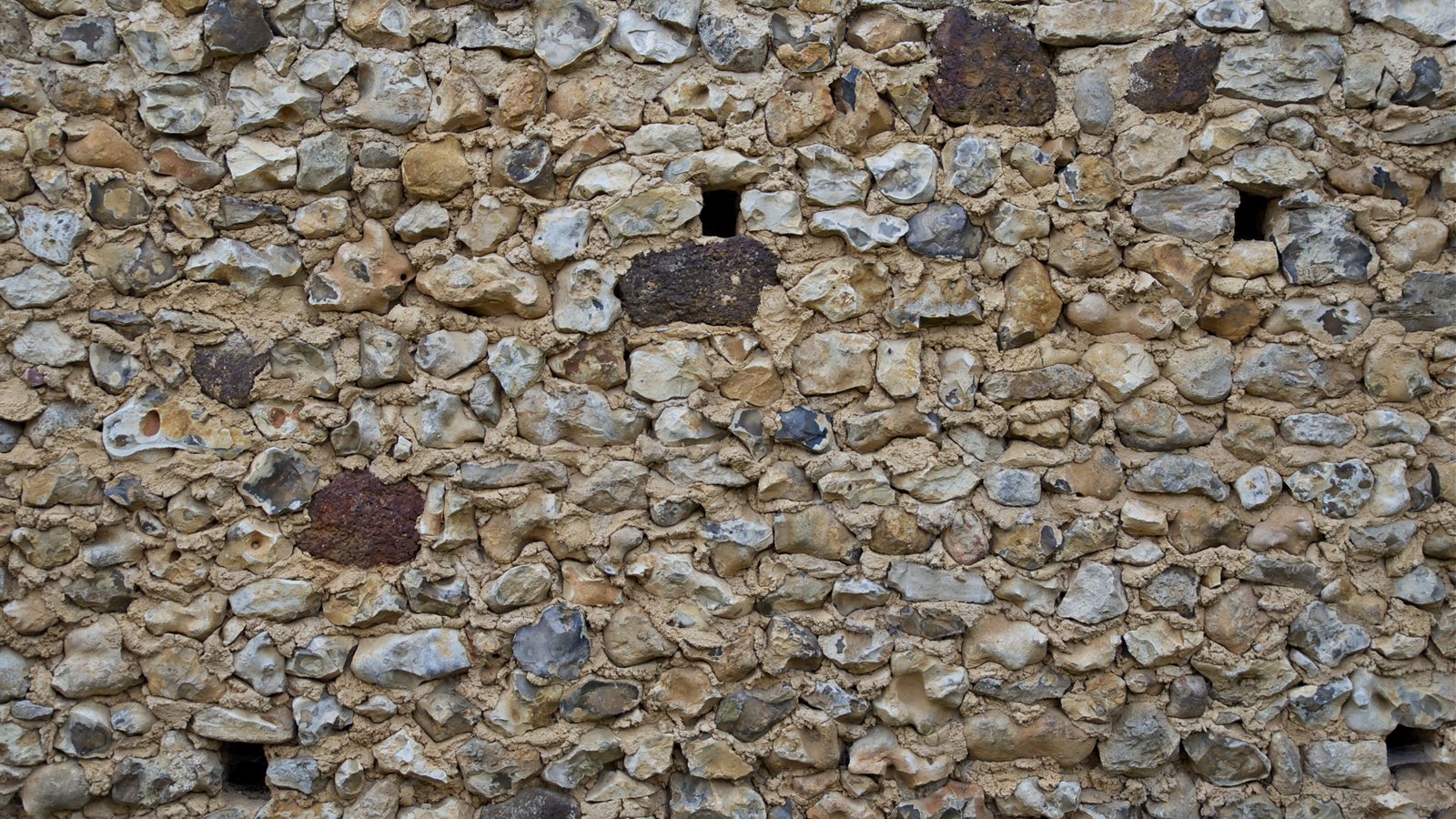 Old dry stone farm wall in the countryside